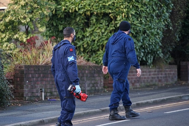 Officers at the scene on Hollin Lane, Middleton