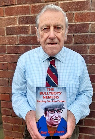 Roy MacElwee with his book The Bullyboys’ Nemesis 