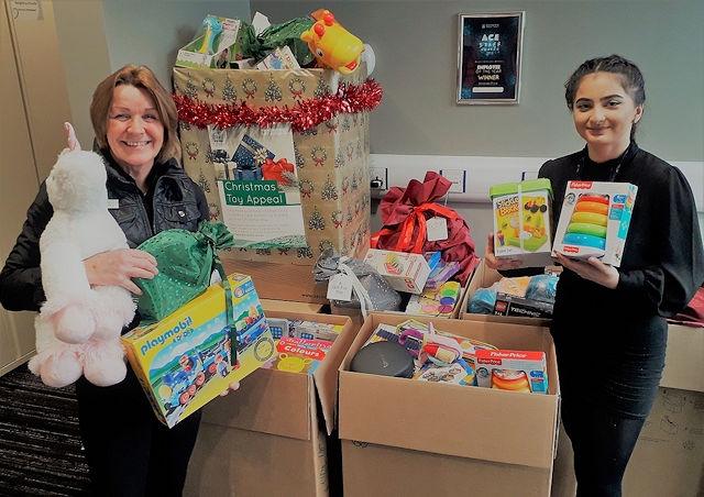 Amanda Price and Elisha Mahmood from Rochdale Borough Council helping collect gifts last year, when over 2,500 were donated and delivered