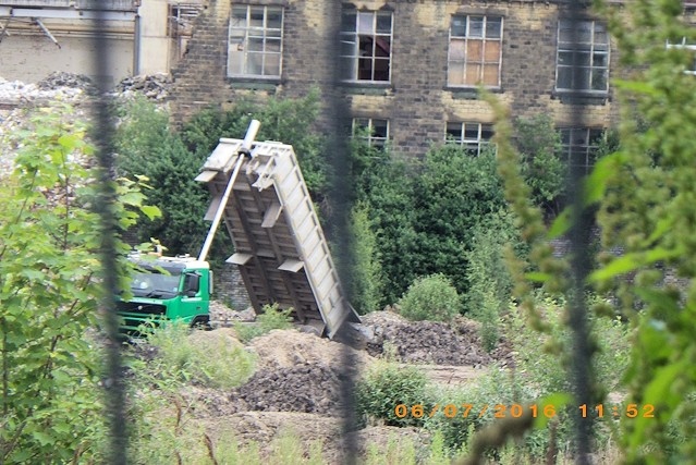 A lorry dumping waste at the former Turner Brothers Asbestos site in Rochdale