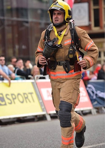 Aaron Parmar at the Manchester 10k in his firefighting uniform