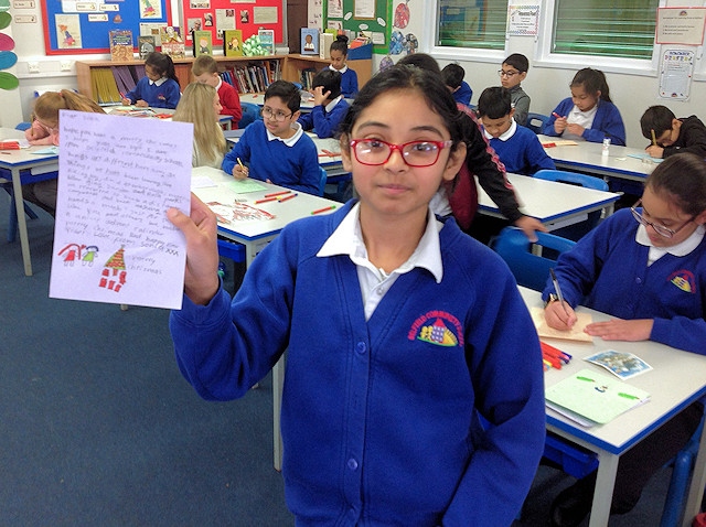 Belfield Primary School students decorating Christmas cards