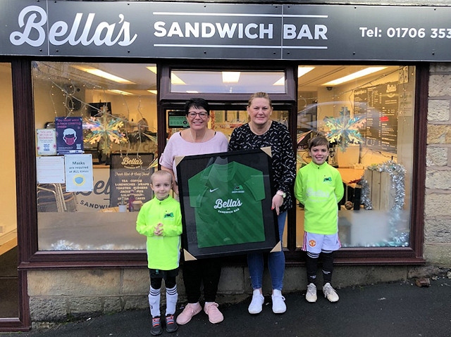 Bella's Sandwich Bar staff with Ballers Coaching FC players