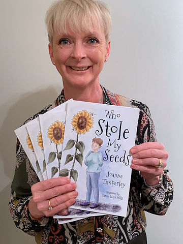 Joanne Timperley with her book, 'Who Stole My Seeds?'