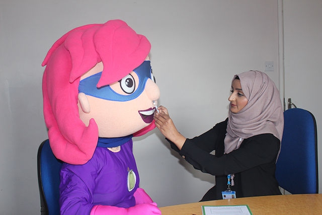 Rochdale's Healthy Hero Rochelle having her nasal flu vaccination to protect her from the flu this winter