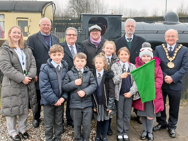Gemma Hardy, teacher from Hopwood Primary School, Cllr Ray Dutton (ELR Trust Member), Cllr Peter Rush (ELR Trust Member), Mike Kelly (Chairman of the ELR), Brian Davies (Chair of ELR Trust) and Cllr Billy Sheerin (Mayor of Rochdale) with local children from Hopwood primary school 