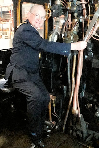 Mayor Billy Sheerin on board the cab of the Lancashire Fusilier engine at Riley & Son, Heywood