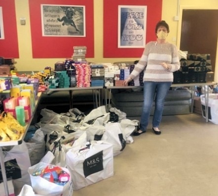 Volunteer Joy Barlow with donations