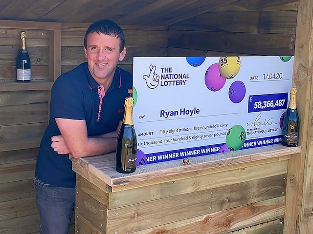 Ryan Hoyle with his EuroMillions jackpot cheque
