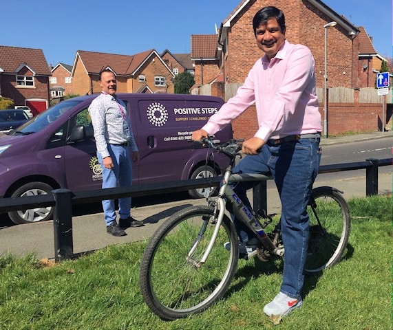Martin Sutton (Positive Cycles) with Councillor Faisal Rana on the bike he donated