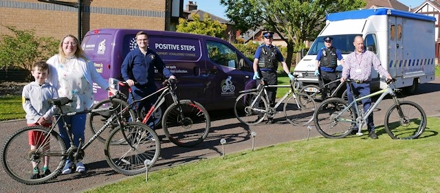 Councillor Rachel Massey and her son, Councillor and NHS Nurse Daniel Meredith, with PCSO Andrew Stewart, PCSO Paul Robinson and Martin Sutton from Positive Cycles