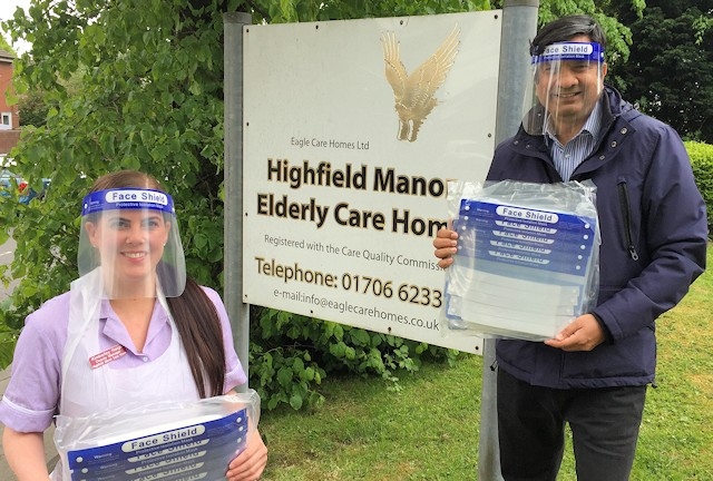 Kimberley Haigh, Deputy Manager of Highfield Manor Care Home receives a donation of face visors from Councillor Faisal Rana