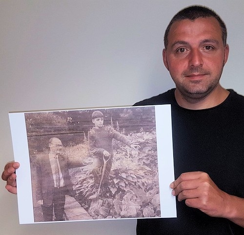 Paul Ellison with a photograph of himself as a child with Councillor Jim Gartside