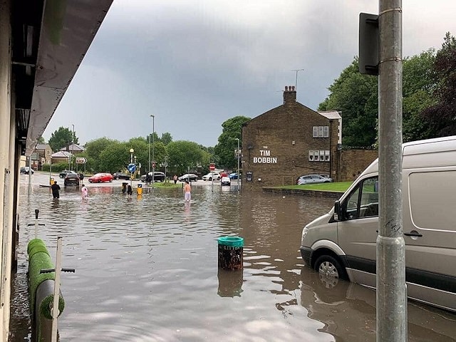 Flash flooding in Milnrow at the junction of Bridge Street, Dale Street and Kiln Street