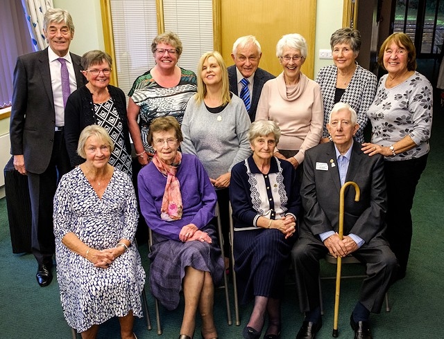 A group of hospice volunteers celebrating 30 years volunteering