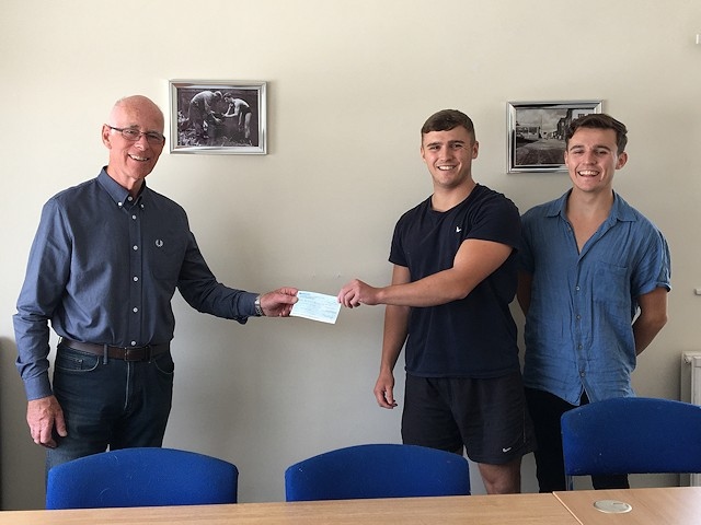 David Canavan (RSPCA trustee) receives the cheque from Brad and Liam Gartland 