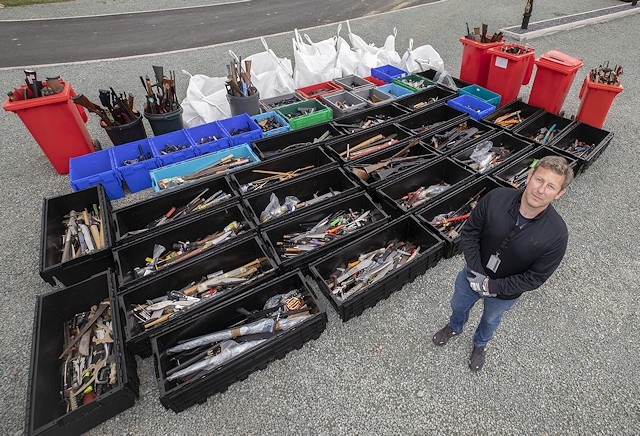 Sergeant Paul Nolan with the knives placed in Forever Amnesty bins