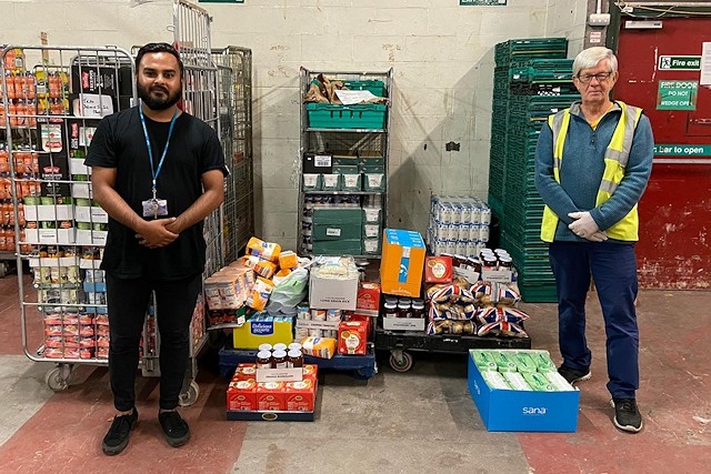 Mr Abdullah from Falinge Park High School delivers supplies to John Rowe at Rochdale Foodbank