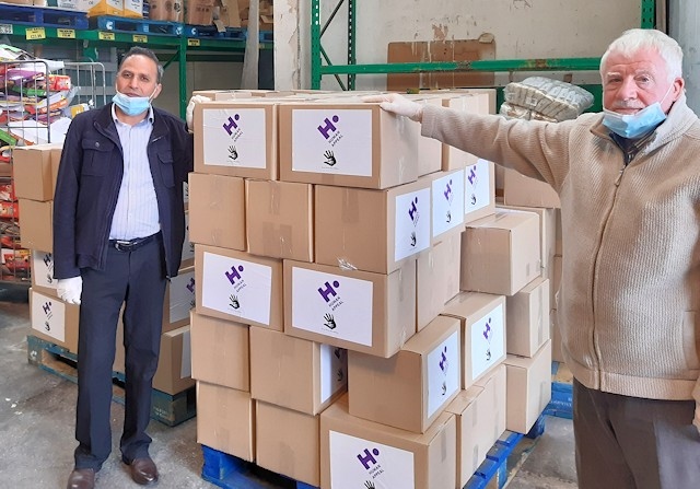 Councillor Shakil Ahmed and Councillor Allen Brett with food parcels packed by Human Appeal