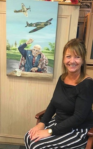 Lisa Haselden with her painting of Captain Tom Moore