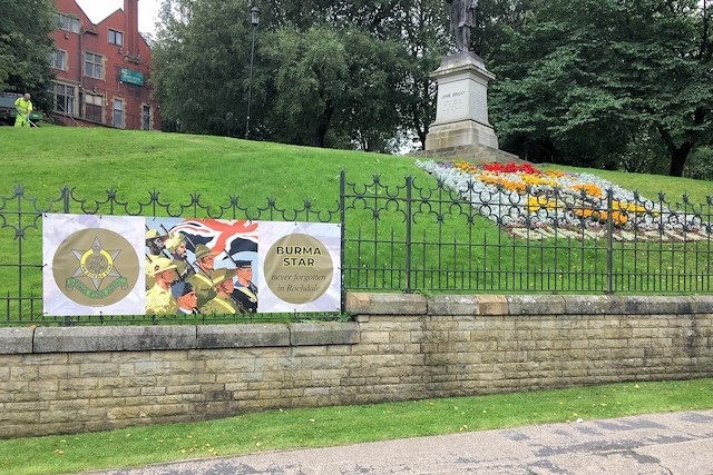 The second banner on the fence of Broadfield Park in front of the floral tribute
