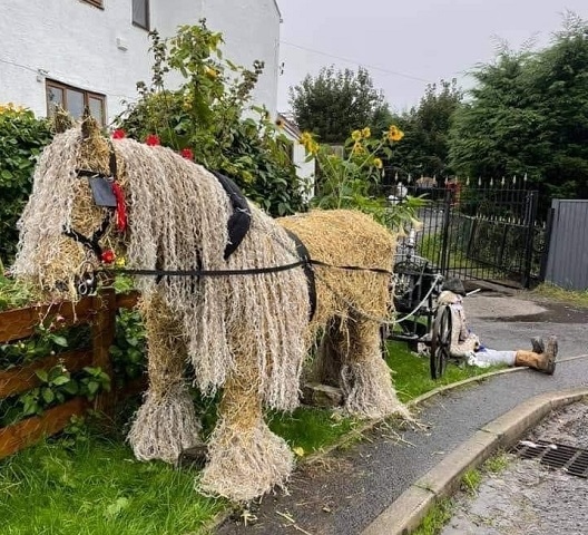 A life-sized horse scarecrow made of straw