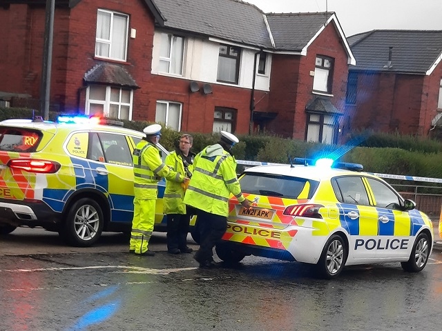 Police at the scene - Rochdale Bypass taped off between Digby Road and Dicken Green