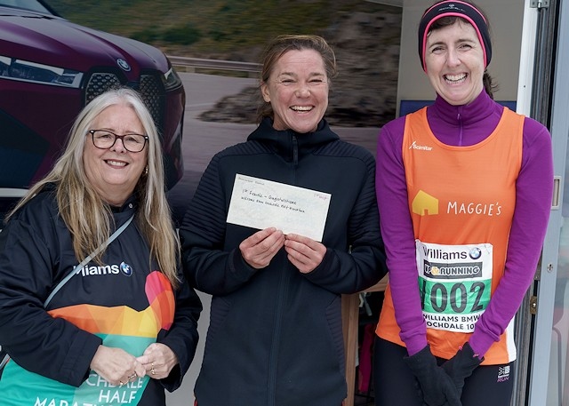 The first female in the half marathon, Dominque Searle, is presented with her prize by Councillor Sue Smith (left) and Alexandra Cook, director of Williams Group (right)