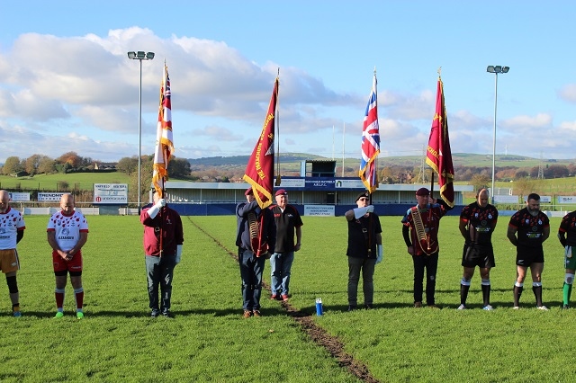 Flagbearers on the pitch before the game