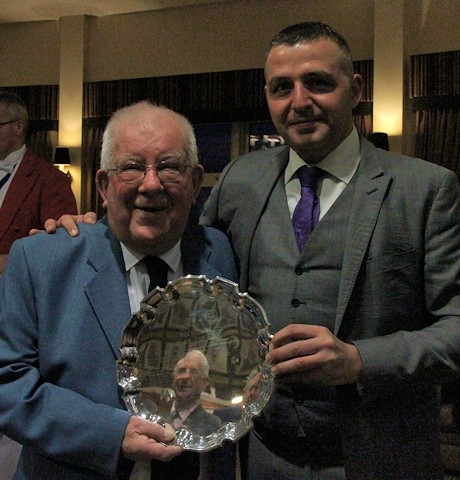 Lieutenant Commander Lawrence Scholes, winner of Man of Rochdale 2021 being presented with the plate by joint winner of Man of Rochdale in 2019, Paul Ellison