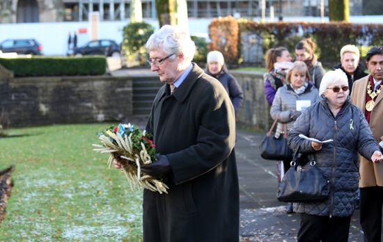 Rochdale MP Sir Tony Lloyd lays a wreath at the Holodomor memorial stone