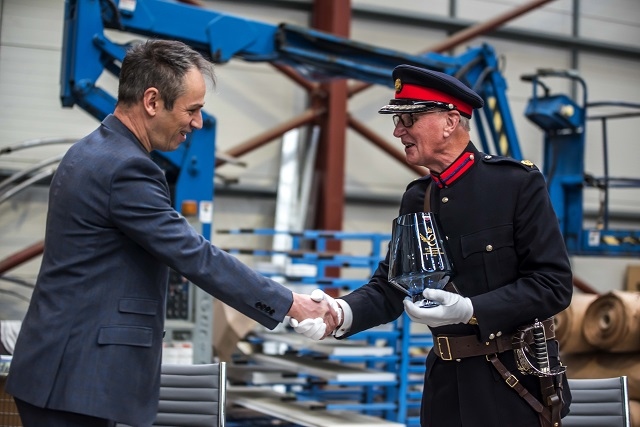 Richard Hagan receives the Queen's Award from Deputy Lieutenant Ian Sandiford 