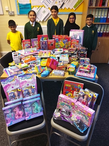 Children from Brimrod Primary School with some of the donations