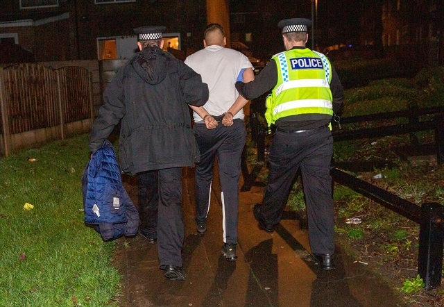 One of the 18 organised crime suspects arrested by officers in Rochdale