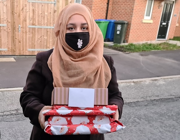 Sanya Karim handed out the donated presents, wrapped with a personalised Christmas card