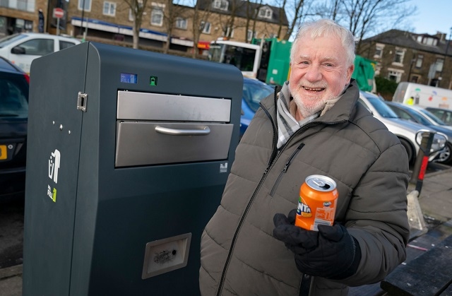 Council Leader Allen Brett trying out the new solar bin at Lake Bank