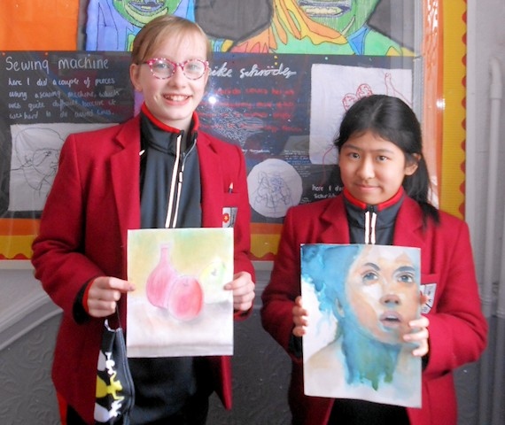 Harriet Whitbread and Ella Raw with their artwork