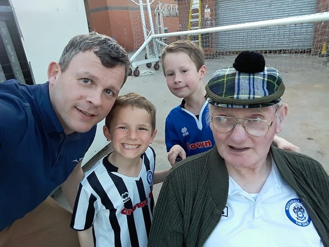 David Clough with Richard Wild and Richard's sons at a Rochdale match