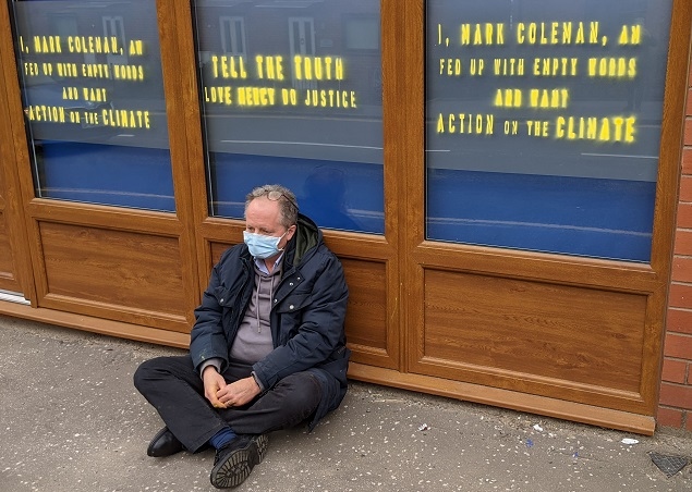 Extinction Rebellion activist Mark Coleman protesting outside MP Chris Clarkson's office in Heywood