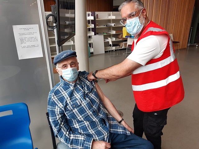 Middleton resident Peter Insley is vaccinated at the Number One Riverside vaccination clinic, Rochdale