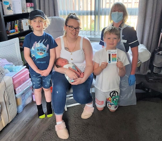 Sarah Carrington, baby Henry 4 weeks, Joshua aged 7, Elyot aged 6 and Health Visitor Louise Wileman.