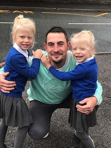 Dad Daniel Clegg, from Rochdale, with twin daughters Pippa and Isobelle