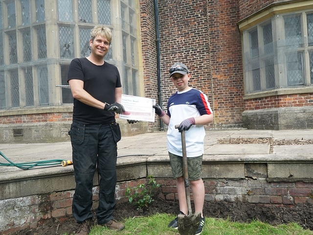 Hopwood DePree presents Luke Pollock with his certificate