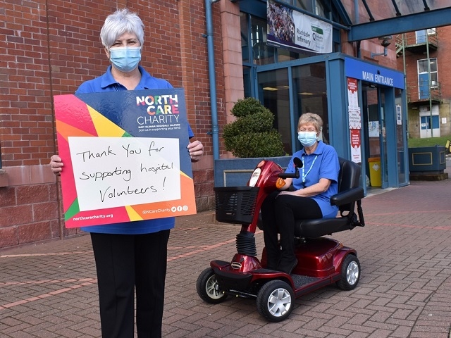 Volunteers Judy Metcalfe and Carolyn Worsley with the bariatric scooter fondly named Madge at Rochdale Infirmary