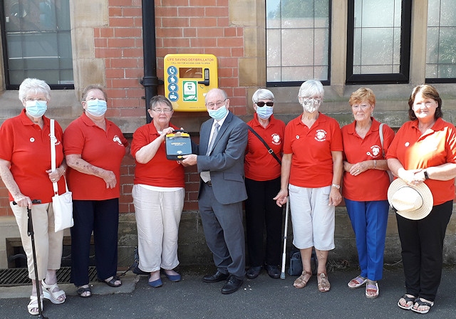 Councillor Billy Sheerin accepted the new defibrillator from Rochdale Heartbeat on behalf of Castleton residents
