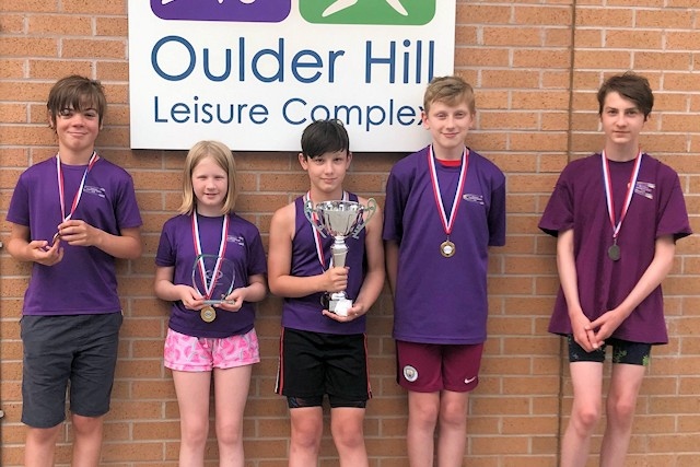 Members of Rochdale Underwater Hockey Club with the Under-12s National Age Group Championships trophy