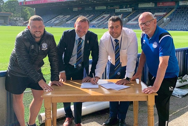 Dale Keogh (Rochdale AFC Military Veterans), Tony Pockney (Rochdale AFC Director), Ryan Bradley (Community Director) and Steve Colesby (Rochdale AFC Walking Football) sign off on the agreement

 