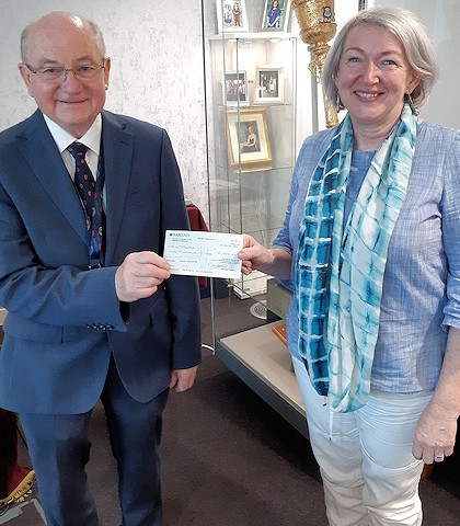 Councillor Billy Sheerin hands a charity cheque to Debs Palmer from M6 Theatre Company