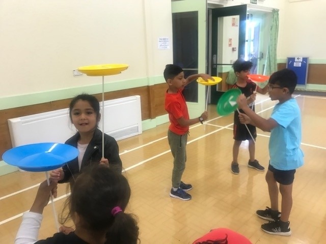 Deeplish Playscheme spinning plates in a circus activity