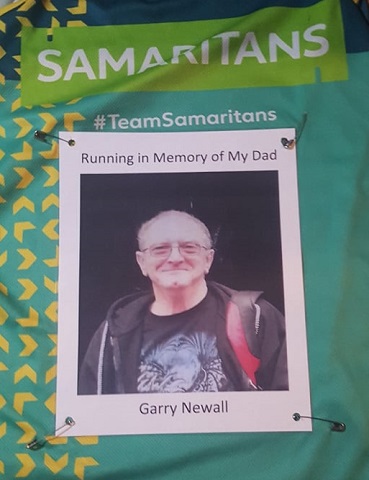 Chris Newall's running vest with a photo of dad Garry